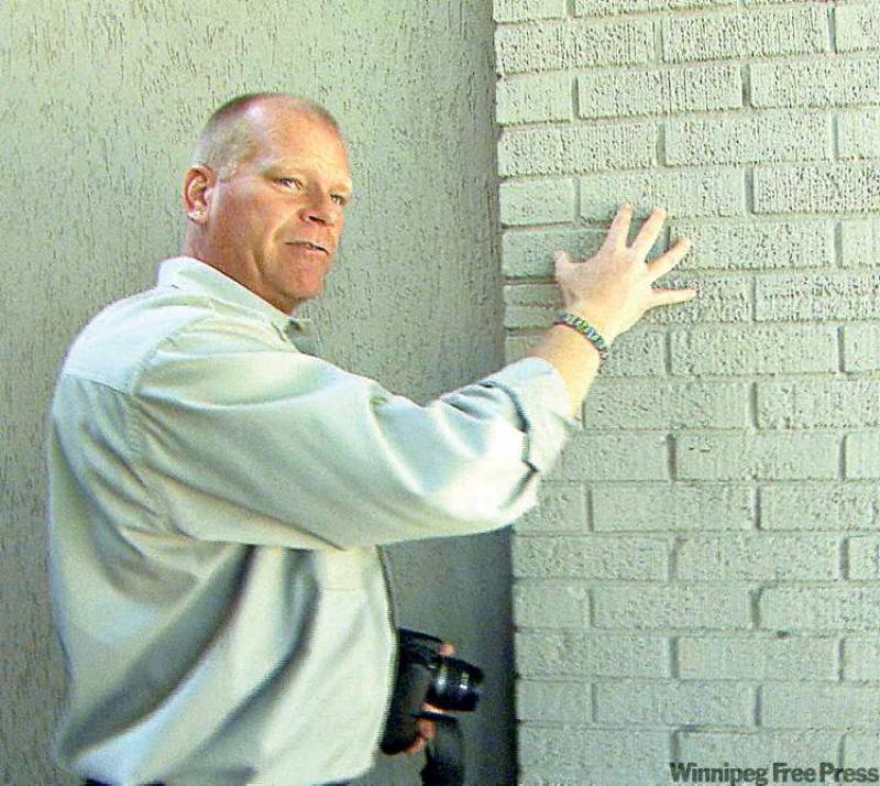 Mike Holmes shows an example of a brick house, a good choice to limit flame spread. 