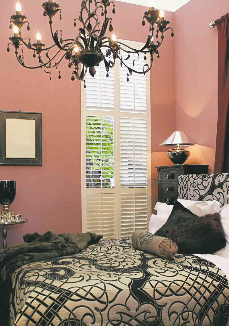 The pink and black colour palette in this bedroom is dramatic, romantic and regal.