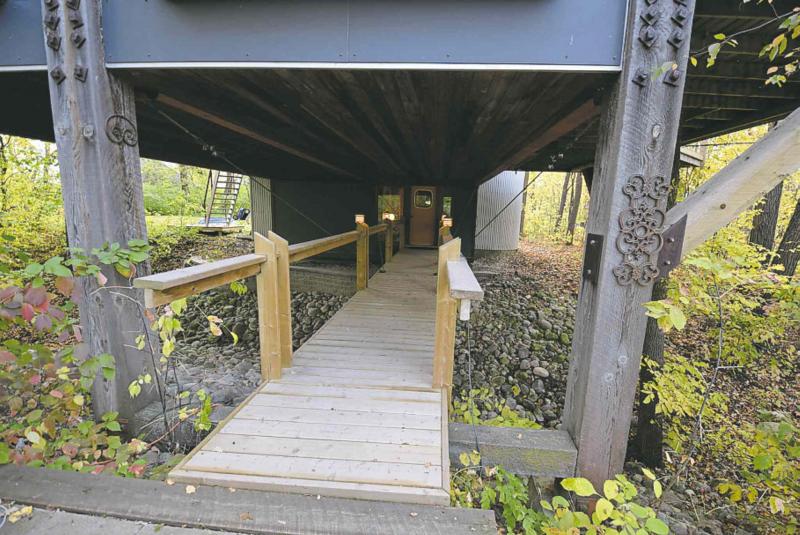 The homeï¿½s entrance is accessed via a catwalk built over a ravine the 2,979 sq. ft., four-level masterpiece spans.