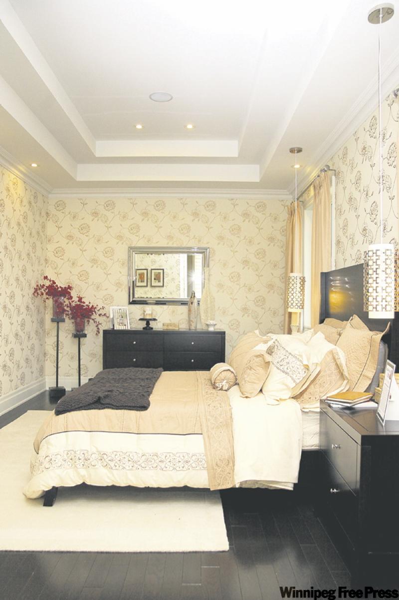 A coffered ceiling, mouldings and baseboard details give bedroom a style boost.
