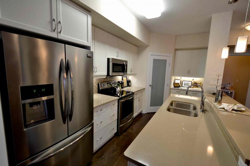 Kitchens come with the choice of five cabinet choices, four handle styles and either quartz or granite countertops; stainless appliances are standard.