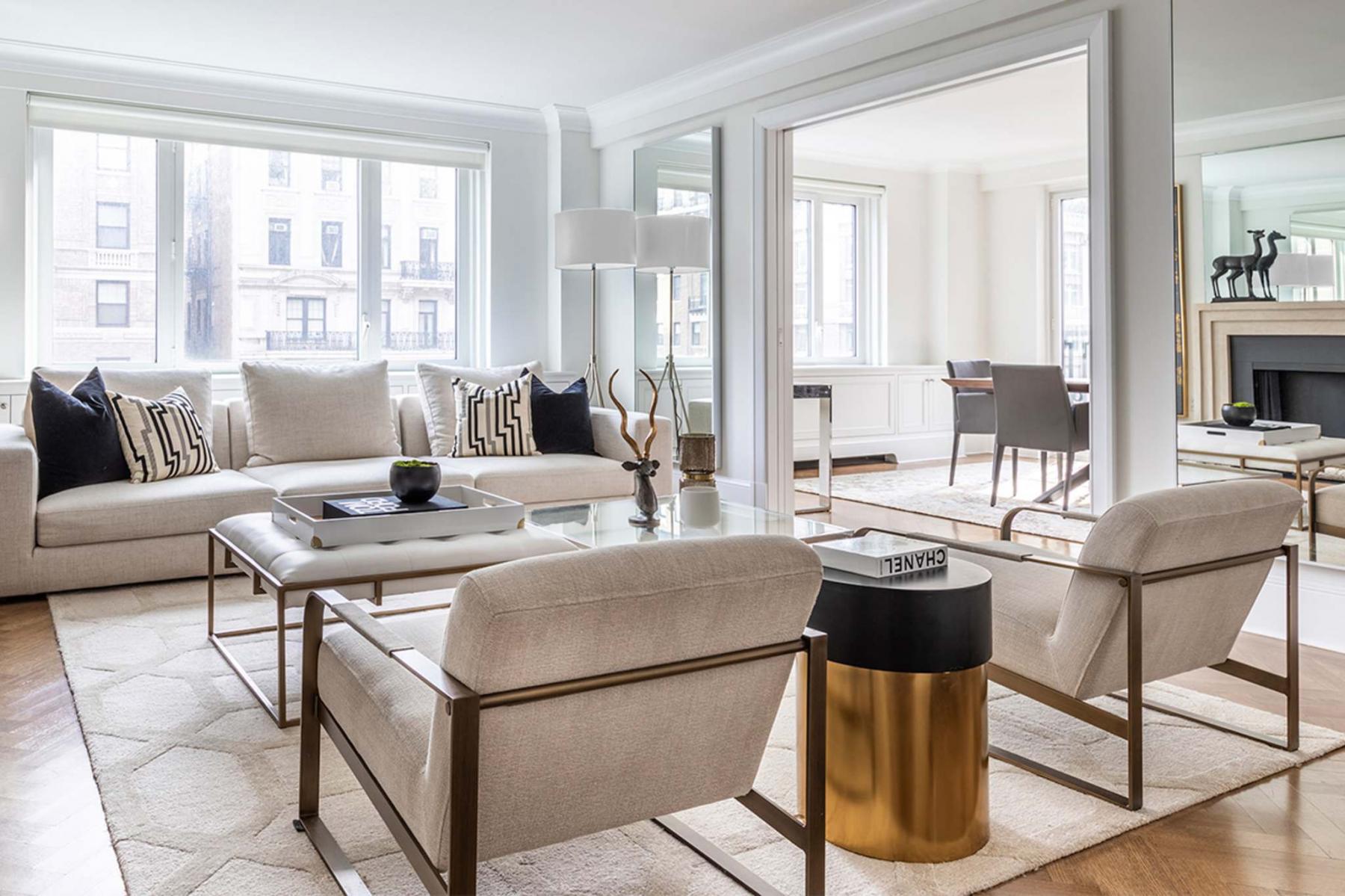 <p>Scott Gabriel Morris / TNS</p><p>Cream-coloured furniture selections are contrasted here with brass accents.</p>