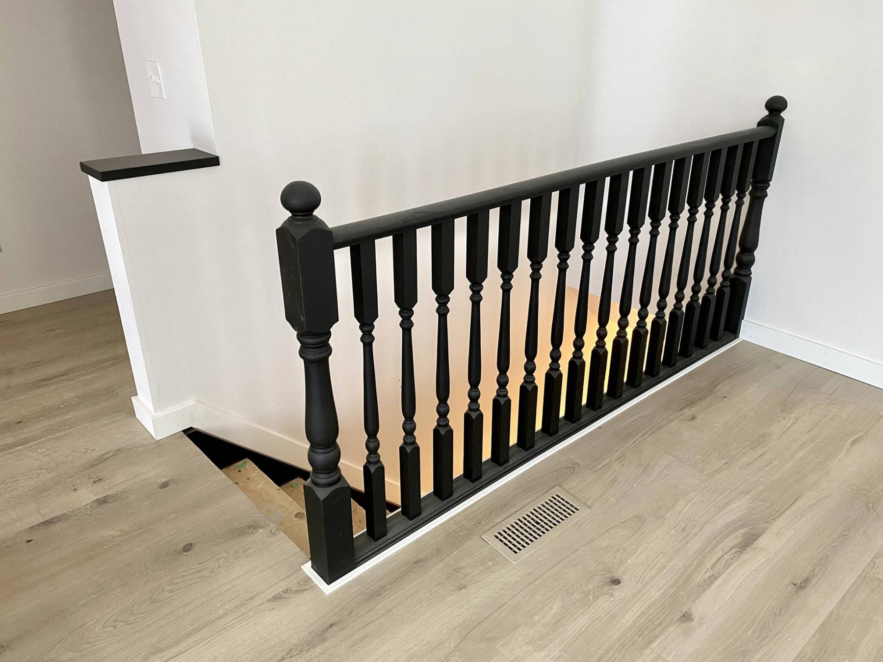 <p>Photos by Marc LaBossiere / Winnipeg Free Press</p><p>The homeowner desired a high-contrast stairwell that includes a banister with satin black finish, encased by white trim along the base.</p>
