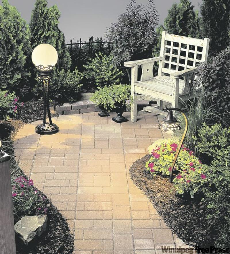 Low-voltage traditional Vintage Park path lamp sheds new light on greening the garden.
