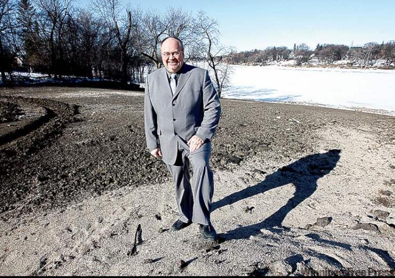 Realtor Bill Thiessen at development under construction on Henderson Highway.
