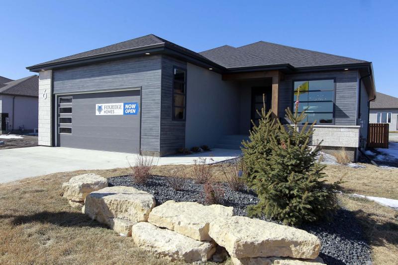 <p>PHOTOS BY BORIS MINKEVICH / WINNIPEG FREE PRESS</p><p>Foxridge Homes&rsquo; stunning new design makes a strong impression from the start, with woodgrain-style aluminum siding, acrylic stucco and tyndall stone accents.</p>