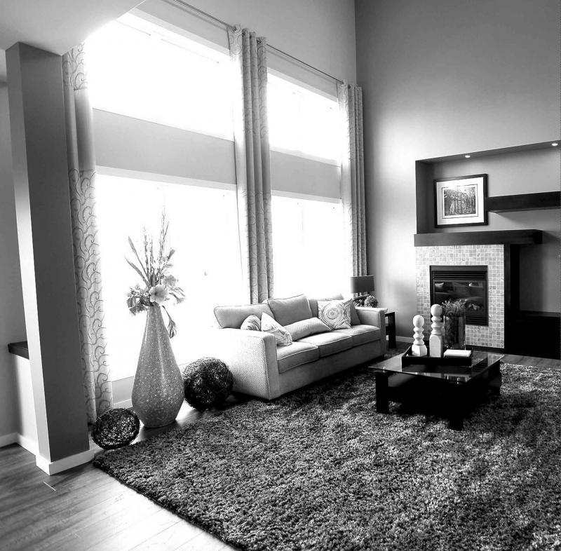 A collection of windows on the rear wall of the family room lets in plenty of light.