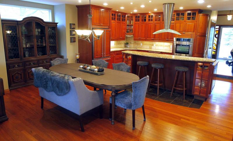 <p>PHOTOS BY BORIS MINKEVICH / WINNIPEG FREE PRESS</p><p>Maple cabinetry defines the kitchen, which also includes granite counters, a double wall oven and an oversized prep island with eating nook.</p>