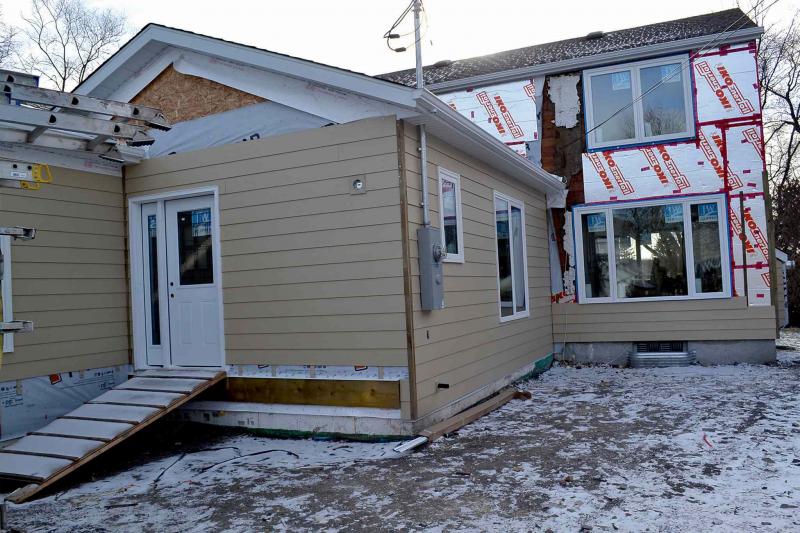 At the back, the new addition is faced with Hardie board and the original house is insulated with 3/4-inch polystyrene backed both sides with reflective foil.