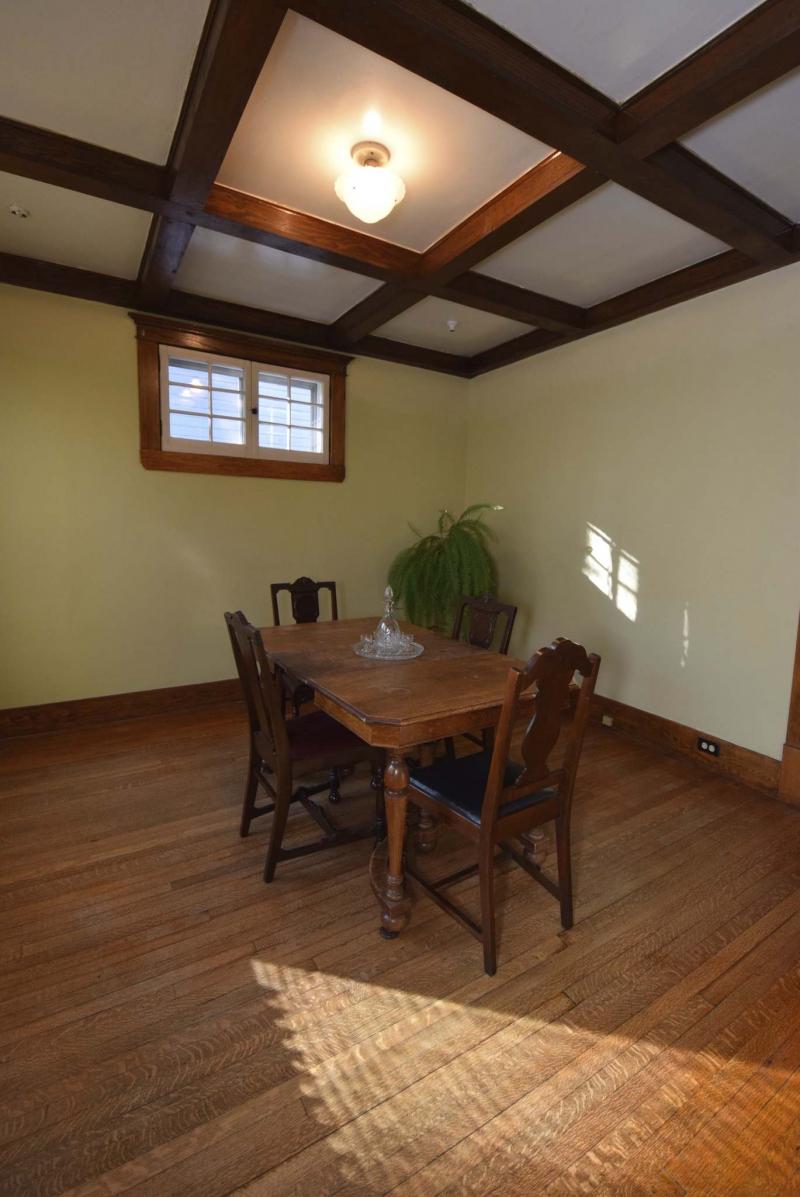 <p>The home&rsquo;s dining room is spacious and has all of the woodwork you&rsquo;d expect at a Wolseley address, including beamed ceilings.</p>