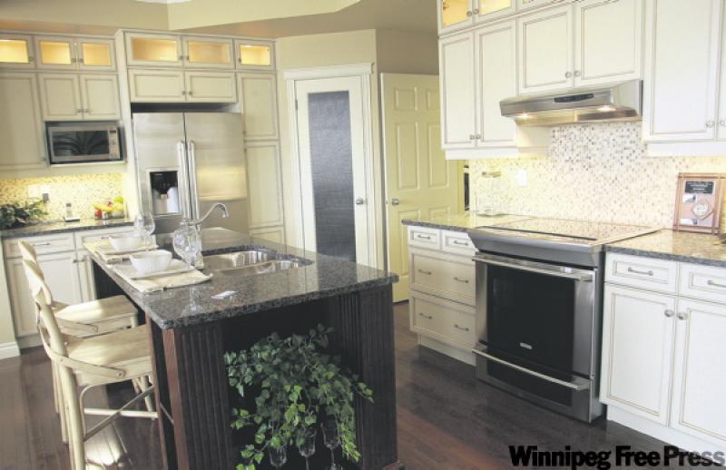 Cream cabinets add a traditional touch to kitchen.