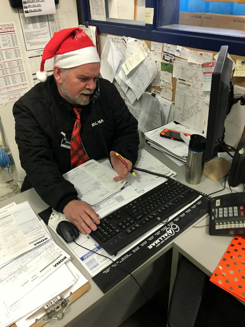 <p>Scott Schappert talks with a customer over the phone at Rona Kenaston.</p>