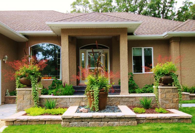 <p>B.Rocke Landscaping</p><p>This purposeful, symmetrical design features stone pillars and stone walls in varying heights.</p></p></p>