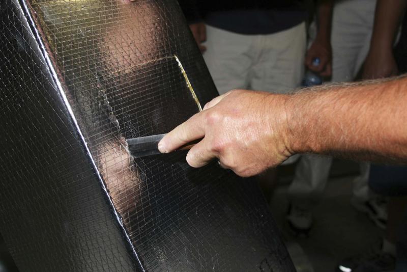 <p>NADCA</p><p>A technician cuts an inspection hole in ductwork. Proper insulation of ductwork can minimize the likelihood of mould due to condensation.</p>