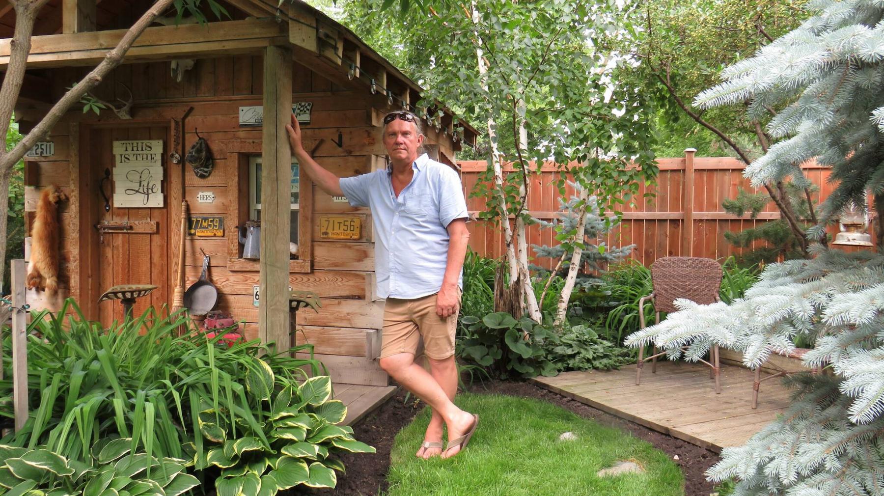 <p>Photos by Colleen Zacharias / Winnipeg Free Press</p>
<p>Willy Klassen, gardener and hunter, stands next to his hand-built log cabin in his Portage la Prairie garden.</p>
