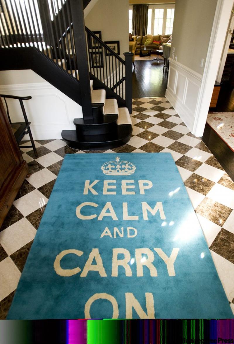 A large 'rescued' rug lies inside the front door of interior designer Michelle Mawby's home.