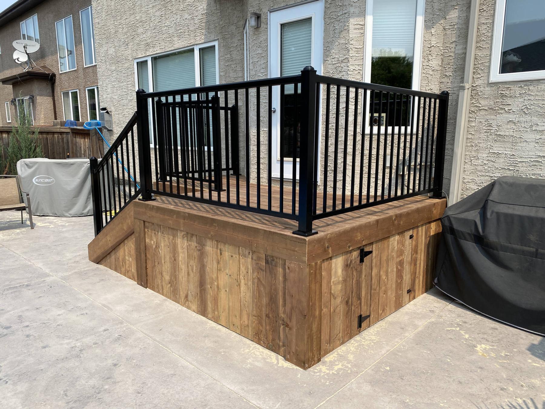  <p>Fully skirted, a small door provides access to the storage area below the deck.</p> 
