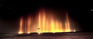 PHIL.HOSSACK@FREEPRESS.MB.CA 101130-Winnipeg Free Press Columns of light reach skyward to the stars above Sanford Mb Tuesday night. The effect is produced by streetlights refracting through ice crystals suspended in the air on humid winter nights. Stand Up.....