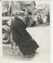 Winnipeg - Manitoba Roars Rousing Western Welcome to Royality This elderly resident of Winnipeg's north end is displaying patience as, comfortably sealed along the route of the royal procession, on Salter street, she awaits the arrival o£ King George VI and Queen Elizabeth. May 25 1939. fparchive