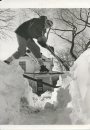 Gerry Cairns/ Winnipeg Free Press Archives Winnipeg Blizzard (2) March 5, 1966 Skier on Snow Banks- Furby Street, after snow storm fparchive