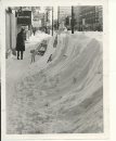 Jerry Cairns/Winnipeg Free Press Archives Winnipeg Blizzard (11) March 5, 1966 Surveying the results of Friday's blizzard was part of the game Saturday a pedestrians along Portage Avenue gaped in wonderment at snow hurled high long the sidewalks. fparchive