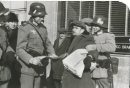 Winnipeg Free Press Archives If Day - World War II - (13) Feb. 19, 1942 Nazi Storm Troopers Demonstrate Invasion Tactics Squad of storm troops grabs Henry Weppler, Free Press newsie.  fparchive