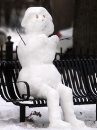 A snowman sits ... 