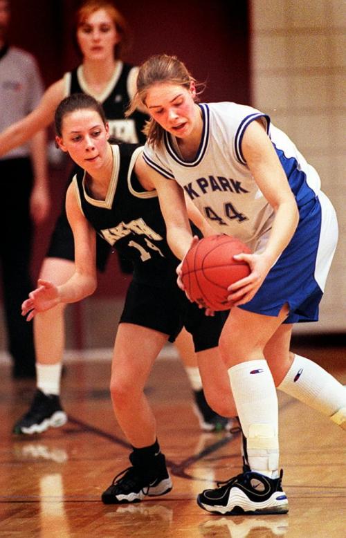 990318-Hoopster's Semi Final-Oak Park Raider #44 Margo Plews hangs onto the ball as Dakota Lancer's #14 Dana Carey tries to extract it from her grip....See Ashley's story....Phil Hossack Mar 18-99......
