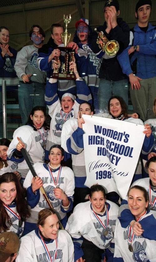 Oak Park Raiders Womens High School Champions with a victory over  St. Norbert Celtics-Raiders celbrate after game with their fans and the Championship banner-at St. Jame Civic Centre- ken gigliotti mar11 1999