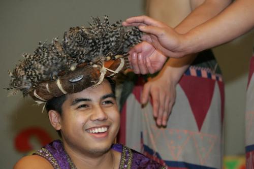 WINNIPEG: NOVEMBER 4, 2004. Jan Reyes, who plays the part of King Marikudo, laughs as his fellow actors feel his feather crown at a dress rehearsal of Maniwangtiwang, named after his queen,  by the Magdaragat troupe, at the Philippine Canadian Centre of Manitoba on Thursday evening. The show will be performed at a gala dinner on Saturday evening, which will be the first annual fundraiser for the centre on Keewatin. Photo by Marianne Helm/Winnipeg Free Press