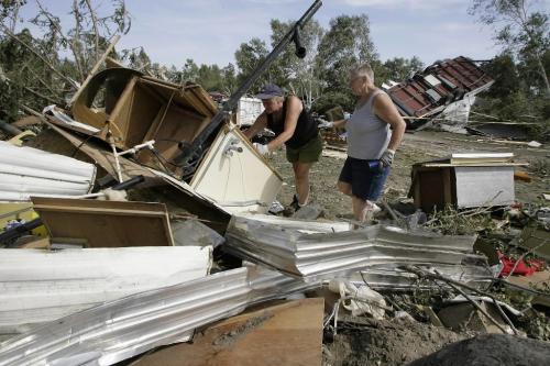John Woods / Winnipeg Free Press / August 8 2006 - 060808 - Linda Godlein (R) and Linda Taylor (L) search through the remains of their trailer for personal belongings Tuesday, August 8/06, a couple of days after a tornado ripped through Gull Lake Saturday, August 5/06.