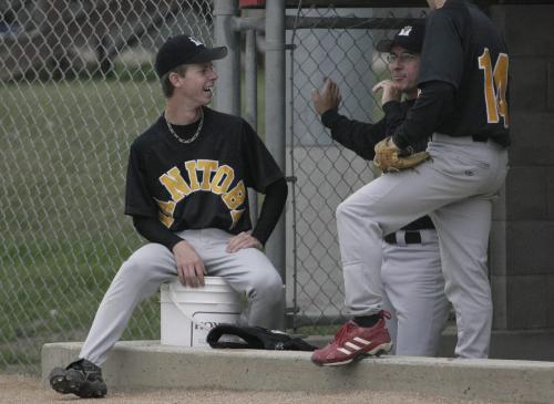 John Woods / Winnipeg Free Press / August 31 2006 - 060831 - Andrew Lochhead relaxes on the bench with a coach and another player from the Manitoba team at the 2nd Annual Baseball Prospects tournament at Whittier Park Thursday, August 31/06.
