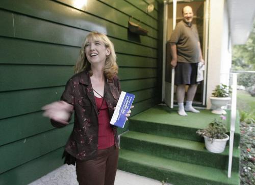 John Woods / Winnipeg Free Press / August 31 2006 - 060831 - Jennifer Zyla, candidate for River Heights - Fort Garry jokes with River Heights resident Tom Dubinski while canvassing Thursday, August 31/06.