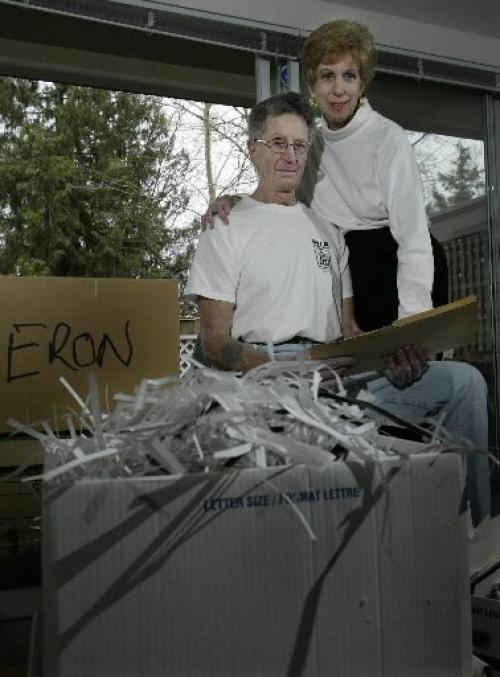 Jim and Mary Tindle does some shredding of his Eron files at his home in Vancouver, BC. April 1, 2005. Last week the former president of Eron Mortgage Corp. Brian Slobogian, was given a six-year prison term on Tuesday in a fraud case called the biggest in British Columbia history. Lyle Stafford/Winnipeg Free Press