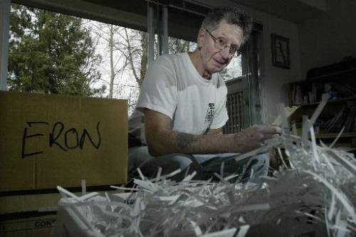 Jim Tindle does some shredding of his Eron files at his home in Vancouver, BC. April 1, 2005. Last week the former president of Eron Mortgage Corp. Brian Slobogian, was given a six-year prison term on Tuesday in a fraud case called the biggest in British Columbia history. Lyle Stafford/Winnipeg Free Press