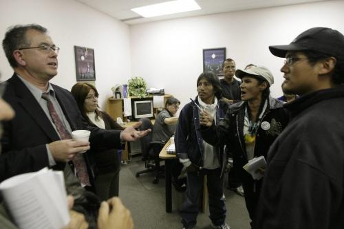 John Woods / Winnipeg Free Press / September 19, 2006 - 060919 - Annabelle Cook (R-white hat), argues with Lionel Chartrand, vice-president of Aboriginal Council of Winnipeg after a meeting of the council was disbanded Sept. 19/06.