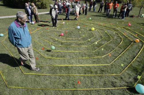 John Woods / Winnipeg Free Press / September 23, 2006 - 060923 - People walk around a mockup of a labyrinth which was set up for a cheque presentation to the Carol Shields Memorial Layrinth at King's Park Saturday, September 23/06.  Helen Fabbri, of the Evergreen Associates ($6000) and Home Depot ($2000 gift card) presented a total of $8000 to the Manitoba Labyrinth Network to help build the memorial.
