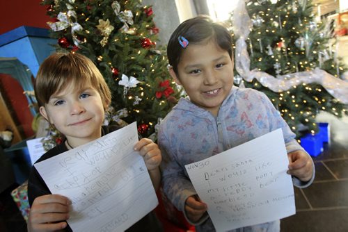 MIKE.DEAL@FREEPRESS.MB.CA 101130 - Tuesday, November 30, 2010 -  (l-r) Richard, 6 and Sheniel, 7, from Norquay School with the letters they wrote to Santa while on a field trip to the Manitoba Hydro building downtown. MIKE DEAL / WINNIPEG FREE PRESS