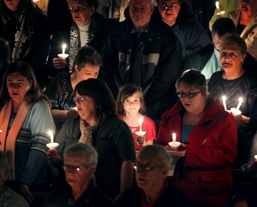 Brandon Sun The congregation gathered at Central United Church sings "Silent Night" by candlelight during the 13th annual Tree of Memories Community Candlelight Memorial Service, Thursday evening. The event, organized by Brockie Donovan, is meant to help those grieving the death of a loved one in the previous year. (Colin Corneau/Brandon Sun)