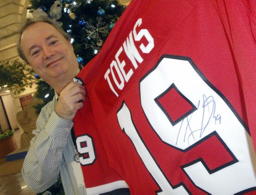 Pennies from Heaven December 03 2010 Kevin Rollason with signed Jonathan Toews jersey winnipeg free press