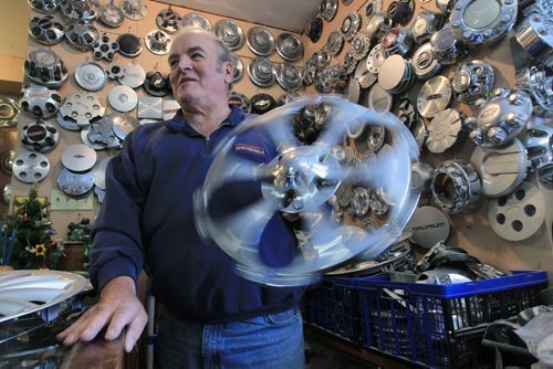 JOE.BRYKSA@FREEPRESS.MB.CA Local- ( see  story) - Baldur Holm has been known as the Hubcap Man in Winnipeg for the last 25 years in Winnipeg- He holds a rotating Cadillac hubcap- JOE BRYKSA/WINNIPEG FREE PRESS- Dec 13, 2010