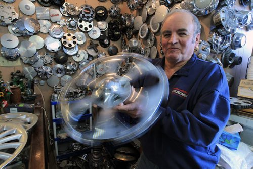 JOE.BRYKSA@FREEPRESS.MB.CA Local- ( see  story) - Baldur Holm has been known as the Hubcap Man in Winnipeg for the last 25 years in Winnipeg- He holds a rotating Cadillac hubcap- JOE BRYKSA/WINNIPEG FREE PRESS- Dec 13, 2010