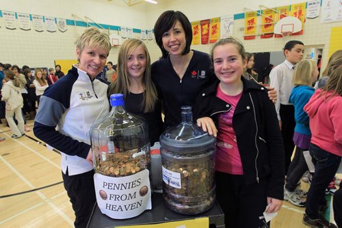 JOE.BRYKSA@FREEPRESS.MB.CA Local- ( see Kevin's  story) -  Olympic athletes Fiona Smith-Bell , hockey, and  Jill Officer with students Hayley Kubin, left and Hannah Barre at   Samuel Burland School with pennies collect for Winnipeg Free Press Pennies from Heaven campaign- JOE BRYKSA/WINNIPEG FREE PRESS- Dec 13, 2010