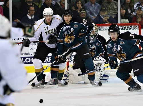 Manitoba Moose vs Texas Stars, Austin, Texas. Credit: Portraits by Deena. December 14 2010. 17 Tomas Vincour of Texas. 43 is Chris Tanev of Moose. 3 is Lee Sweatt for the Moose. For Winnipeg.