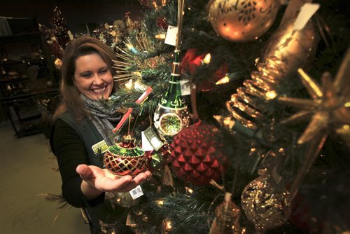 MIKE.DEAL@FREEPRESS.MB.CA 101214 - Wednesday, December 15, 2010 - Deanne Cram the greenhouse manager at Shelmerdine's Garden Centre with some ornaments and decorations. See Breanne Massey story. MIKE DEAL / WINNIPEG FREE PRESS