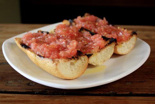 MIKE.DEAL@FREEPRESS.MB.CA 101215 - Wednesday, December 15, 2010 - Carolina Konrad and chef Adam Donelly in their Tapas restaurant Segovia on Stradbrook Avenue. In the photo is the Pan con tomate. See Wendy Burke story. MIKE DEAL / WINNIPEG FREE PRESS