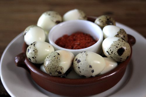 MIKE.DEAL@FREEPRESS.MB.CA 101215 - Wednesday, December 15, 2010 - Carolina Konrad and chef Adam Donelly in their Tapas restaurant Segovia on Stradbrook Avenue. In the photo is the Quail egg's with paprika sea salt. See Wendy Burke story. MIKE DEAL / WINNIPEG FREE PRESS
