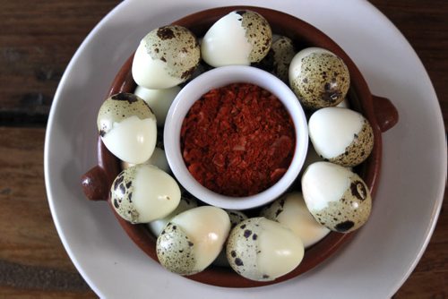 MIKE.DEAL@FREEPRESS.MB.CA 101215 - Wednesday, December 15, 2010 - Carolina Konrad and chef Adam Donelly in their Tapas restaurant Segovia on Stradbrook Avenue. In the photo is the Quail egg's with paprika sea salt. See Wendy Burke story. MIKE DEAL / WINNIPEG FREE PRESS