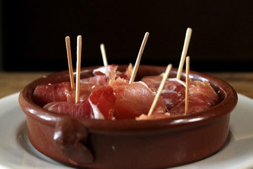 MIKE.DEAL@FREEPRESS.MB.CA 101215 - Wednesday, December 15, 2010 - Carolina Konrad and chef Adam Donelly in their Tapas restaurant Segovia on Stradbrook Avenue. In the photo is the Melon wrapped in Serrano Ham. See Wendy Burke story. MIKE DEAL / WINNIPEG FREE PRESS
