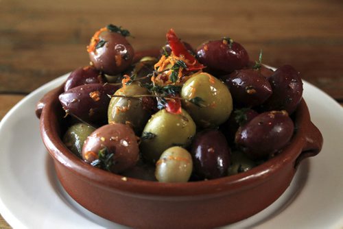 MIKE.DEAL@FREEPRESS.MB.CA 101215 - Wednesday, December 15, 2010 - Carolina Konrad and chef Adam Donelly in their Tapas restaurant Segovia on Stradbrook Avenue. In the photo is the mixed olives in orange and thyme. See Wendy Burke story. MIKE DEAL / WINNIPEG FREE PRESS